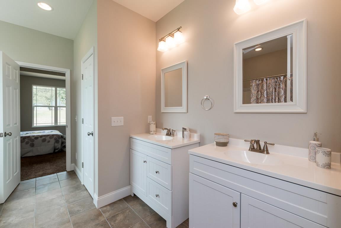 708 Ruby Way White Bluff, TN 37187 - Photo 25 of 30 a en suite bathroom with 2 sink flowerpot and a mirror