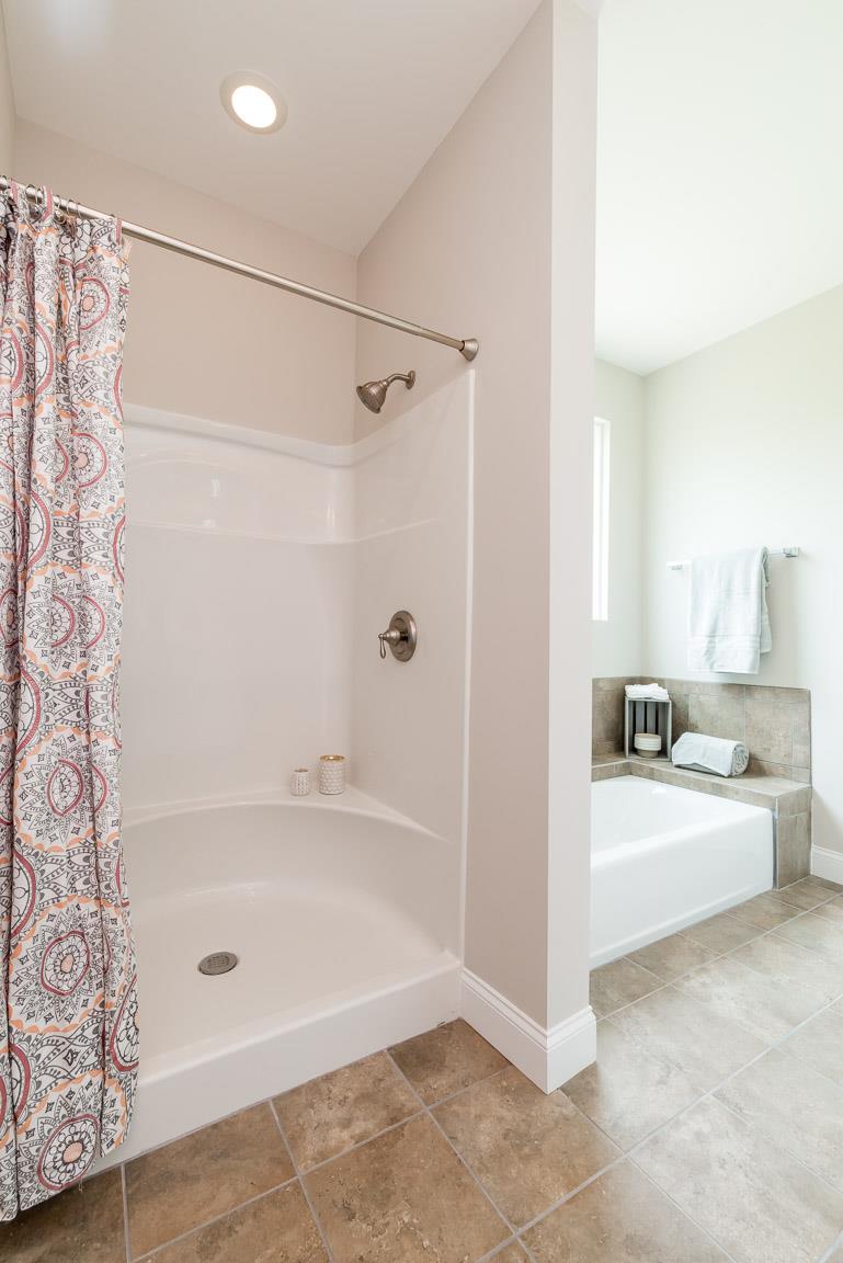 708 Ruby Way White Bluff, TN 37187 - Photo 27 of 30 a bathroom with a bathtub and shower