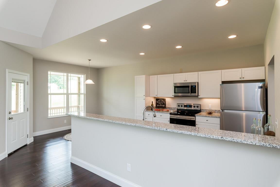 708 Ruby Way White Bluff, TN 37187 - Photo 28 of 30 a kitchen with stainless steel appliances a refrigerator and a stove top oven
