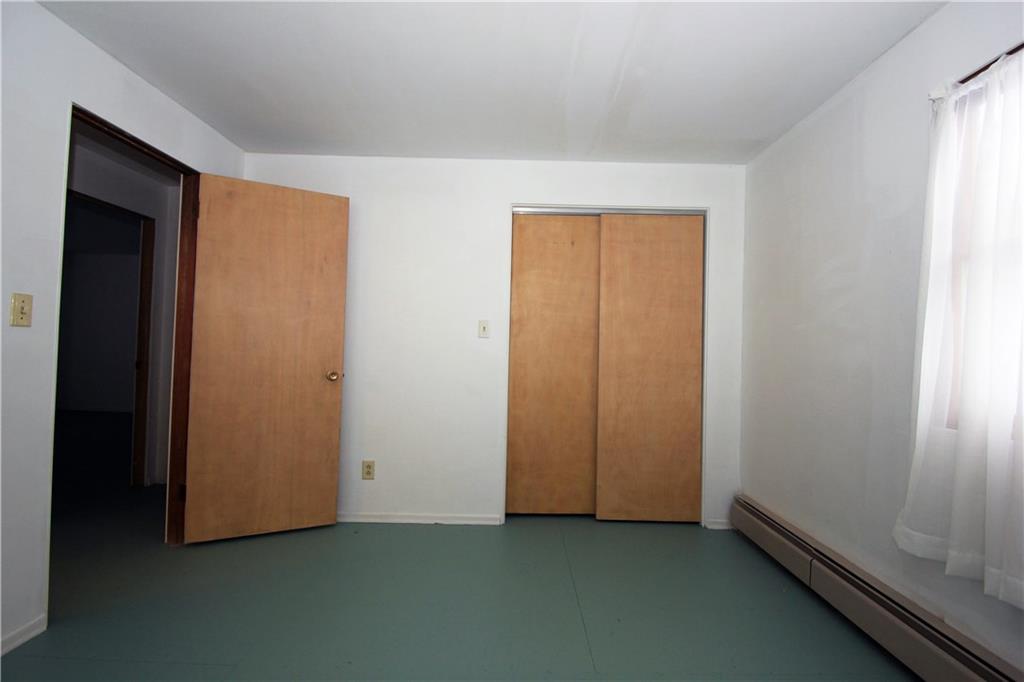 1122 Hamil Road Penn Hills, PA 15147 - Photo 14 of 24 Bedroom #3 - The 3rd bedroom, like the others, has a large closet and a window providing natural light.