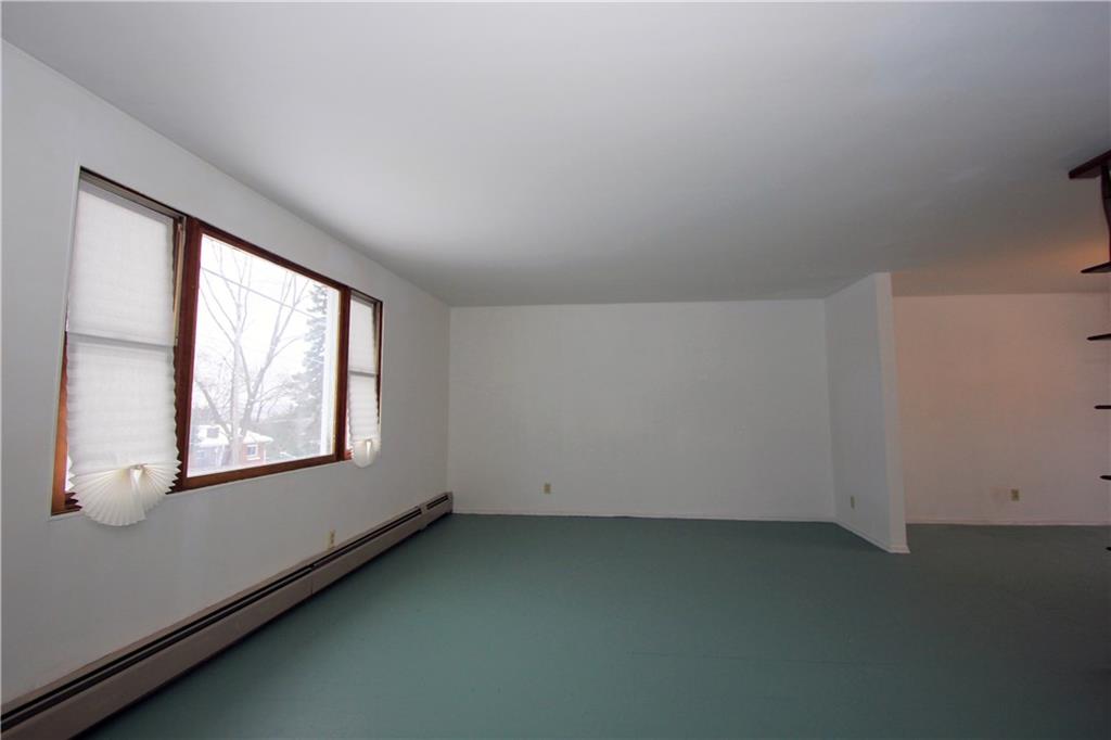 1122 Hamil Road Penn Hills, PA 15147 - Photo 3 of 24 This alternate view of the living room highlights the large front window and part of the dining room on the right side of the picture.