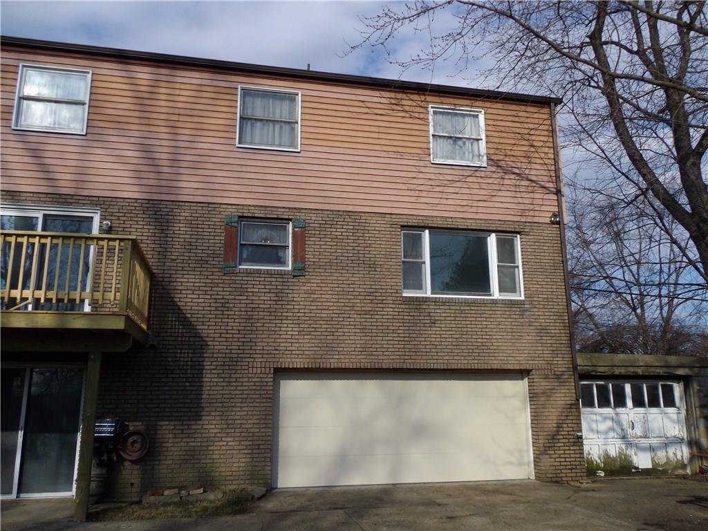 1122 Hamil Road Penn Hills, PA 15147 - Photo 23 of 24 Back of House - This picture was taken before the snow hit! This view provides a close up look at the back of the house and a good look at the attached 2 car tandem garage that is currently used for storage.