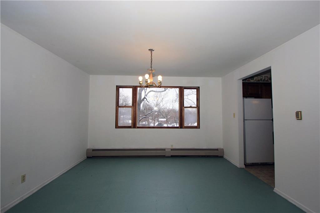 1122 Hamil Road Penn Hills, PA 15147 - Photo 4 of 24 Dining Room - The large formal dining room has a nice chandelier and a large window that overlooks the very spacious rear yard. The doorway to the right leads to the adjacent kitchen.