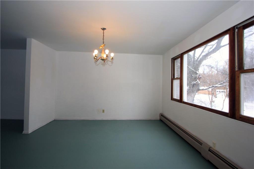 1122 Hamil Road Penn Hills, PA 15147 - Photo 5 of 24 This alternate view provides a different perspective on the large formal dining room which is open to the living room.