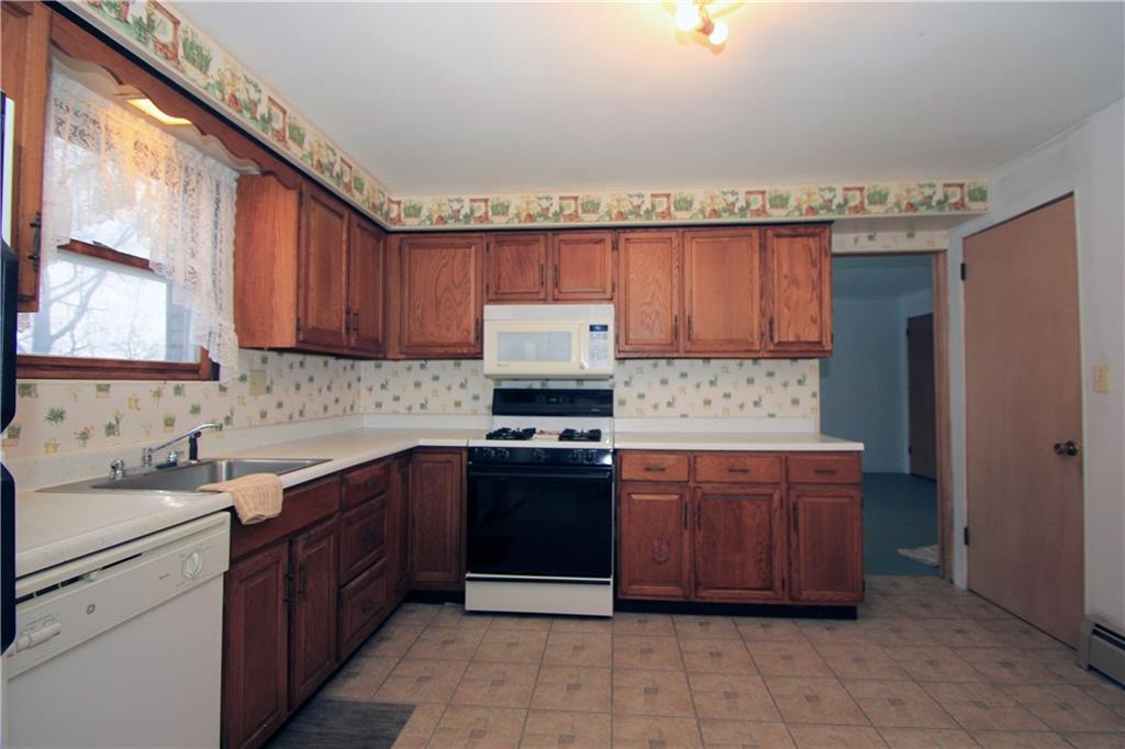 1122 Hamil Road Penn Hills, PA 15147 - Photo 6 of 24 The spacious kitchen has significant cabinetry and counter space. There is plenty of room for a large table and chairs in this kitchen!