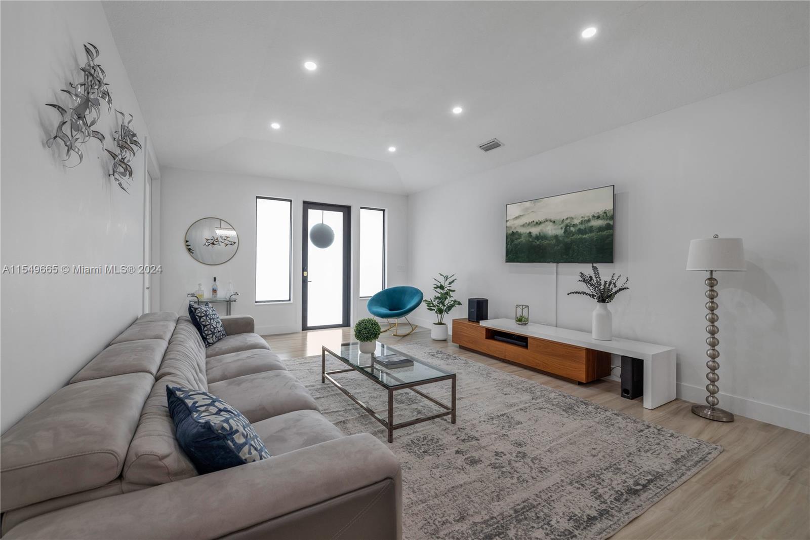1543 Bird Road Coral Gables, FL 33146 - Photo 11 of 65 a living room with furniture and a flat screen tv