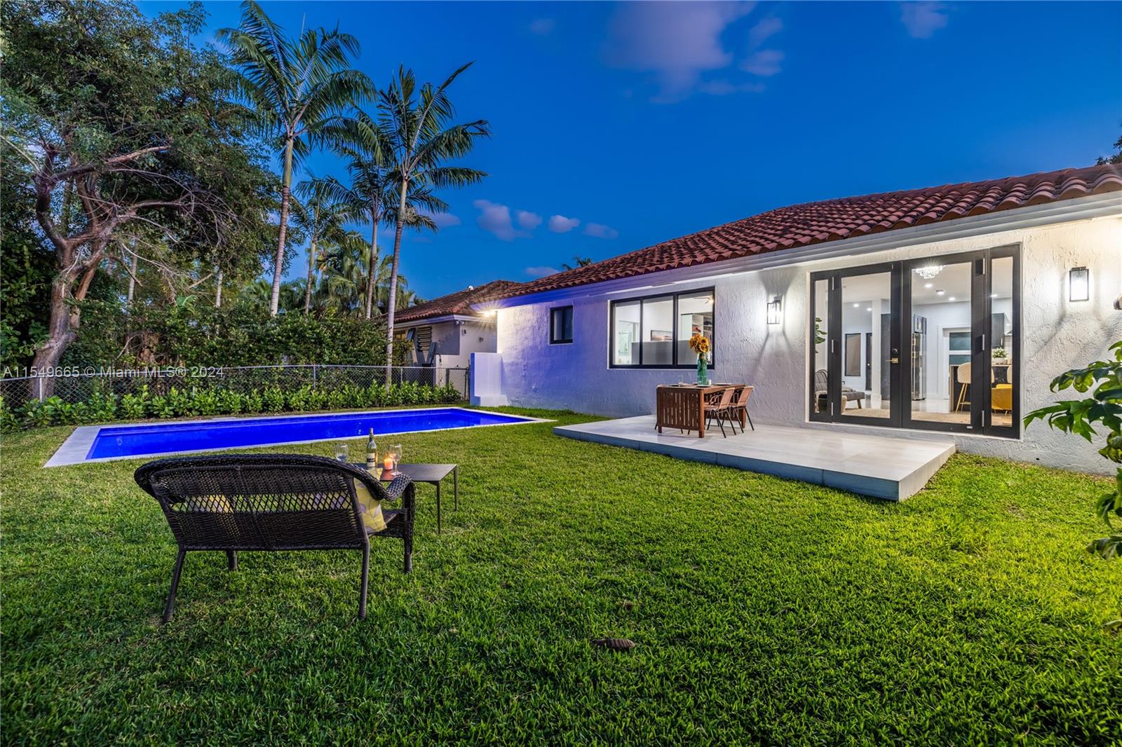 1543 Bird Road Coral Gables, FL 33146 - Photo 18 of 65 a house view with a sitting space and garden