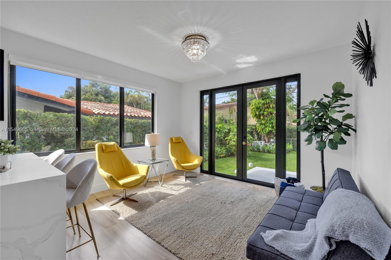 1543 Bird Road Coral Gables, FL 33146 - Photo 25 of 65 a living room with furniture and floor to ceiling windows