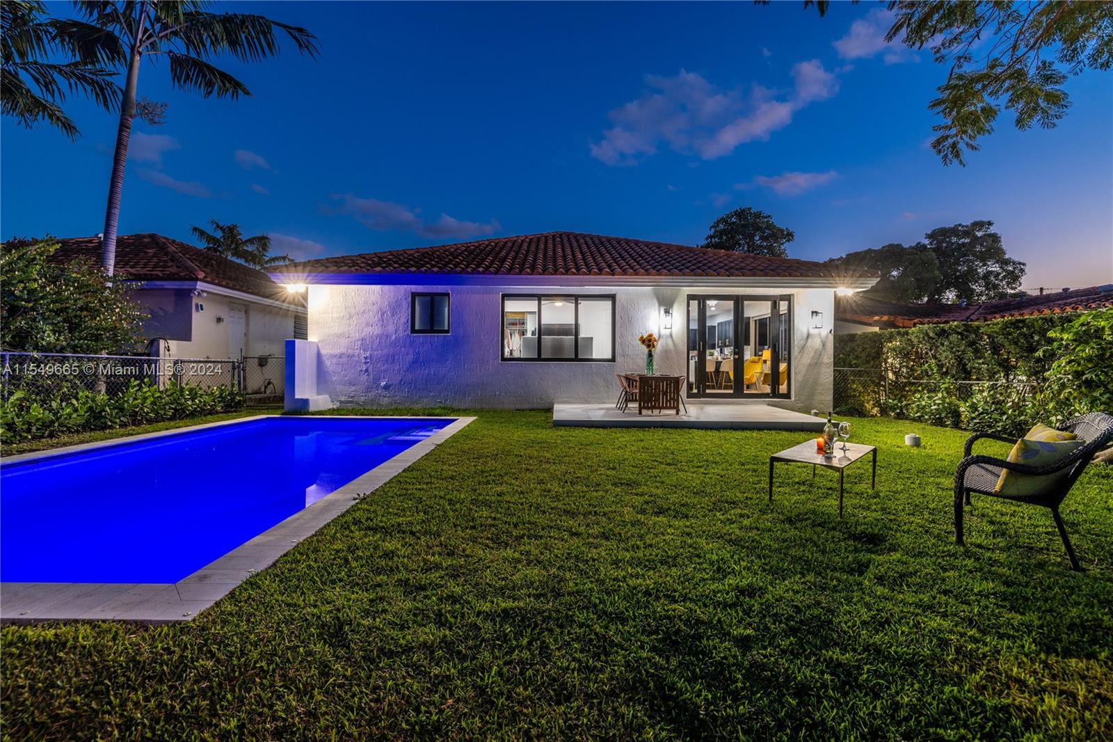 1543 Bird Road Coral Gables, FL 33146 - Photo 27 of 65 a view of a house with a backyard porch and sitting area