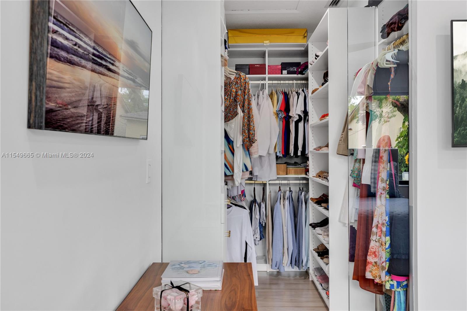 1543 Bird Road Coral Gables, FL 33146 - Photo 33 of 65 a view of walk in closet with clothes