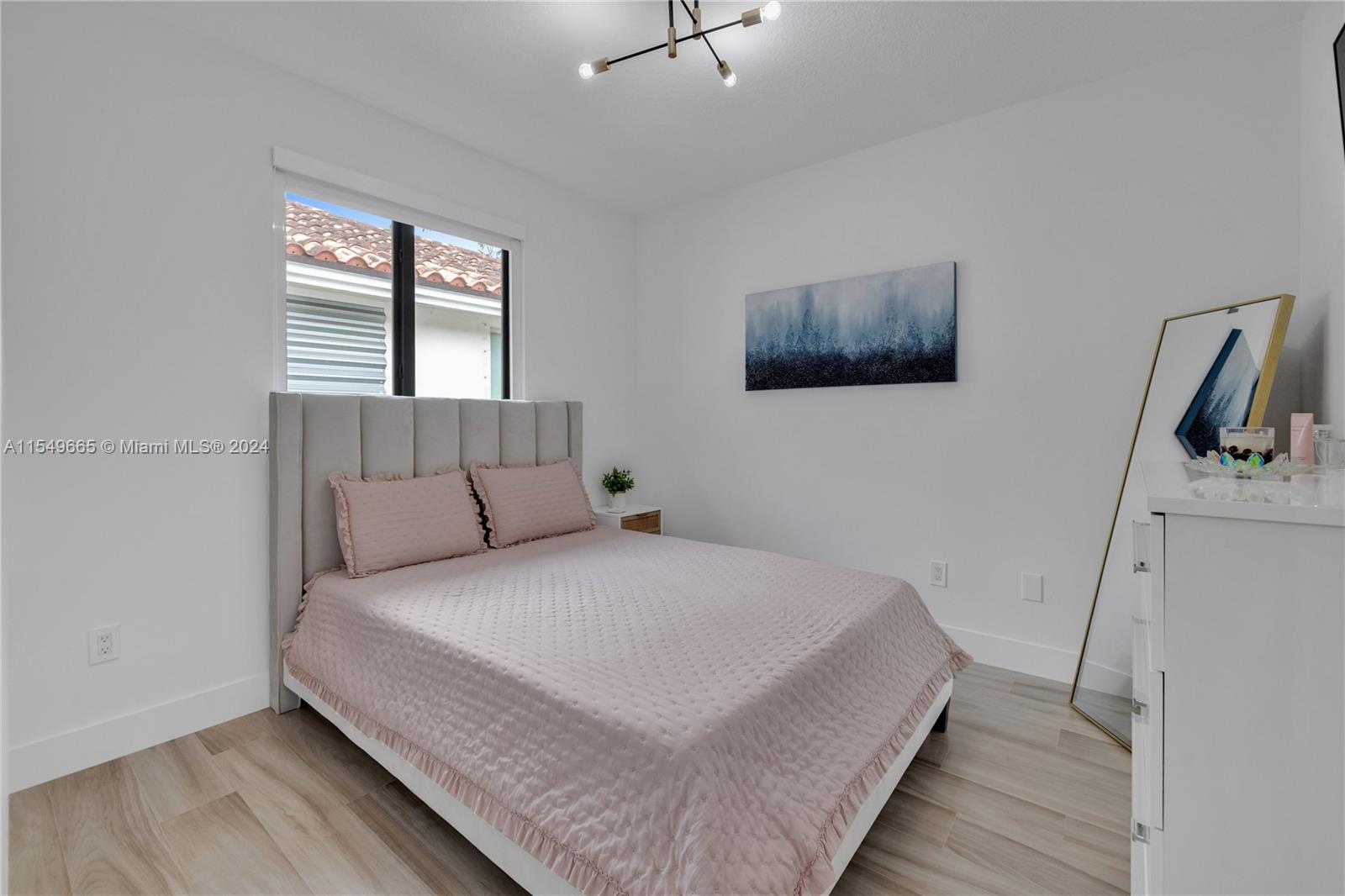 1543 Bird Road Coral Gables, FL 33146 - Photo 36 of 65 a bedroom with a bed and a flat screen tv