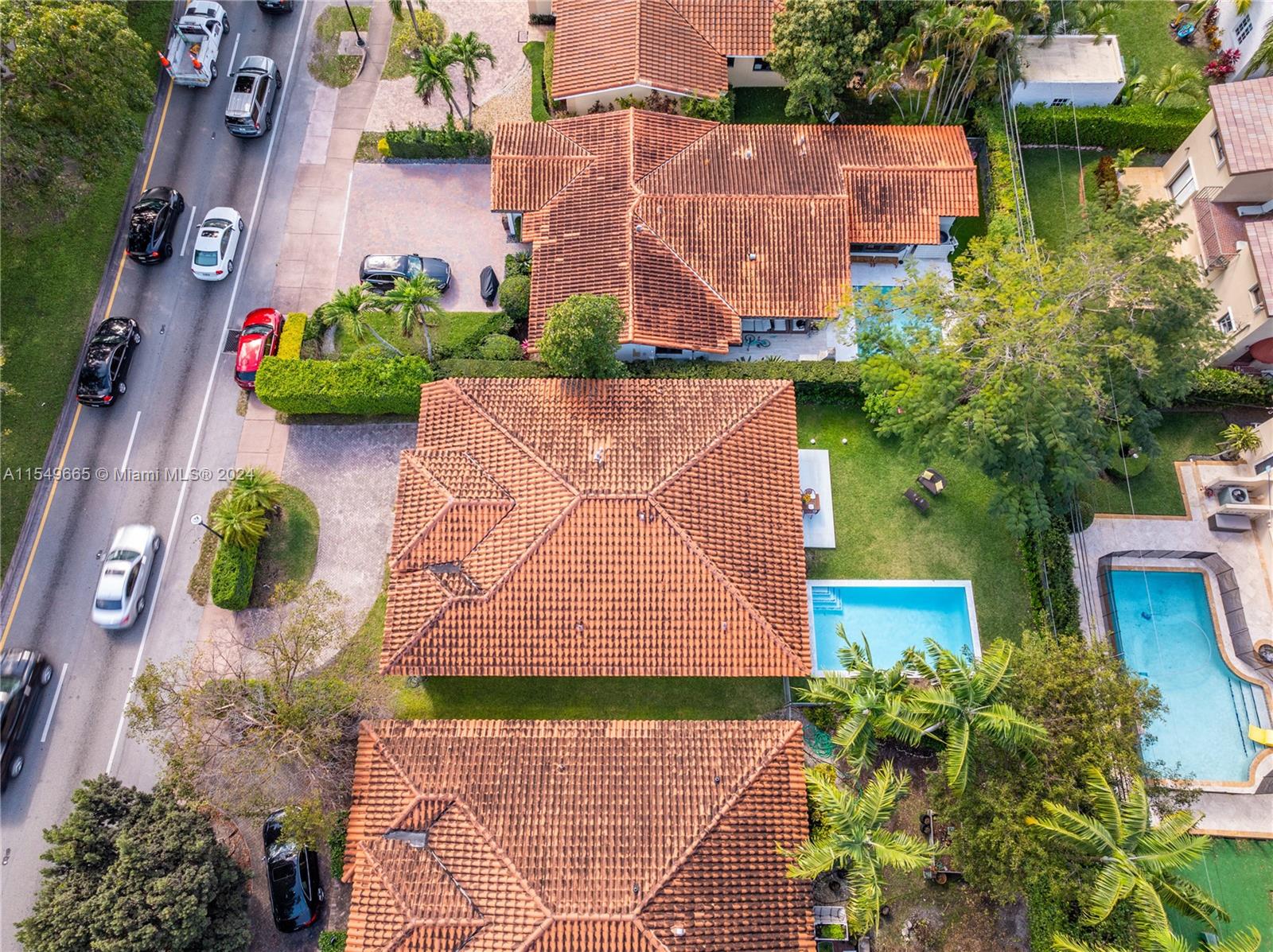 1543 Bird Road Coral Gables, FL 33146 - Photo 50 of 65 an aerial view of a house with a yard and a large tree