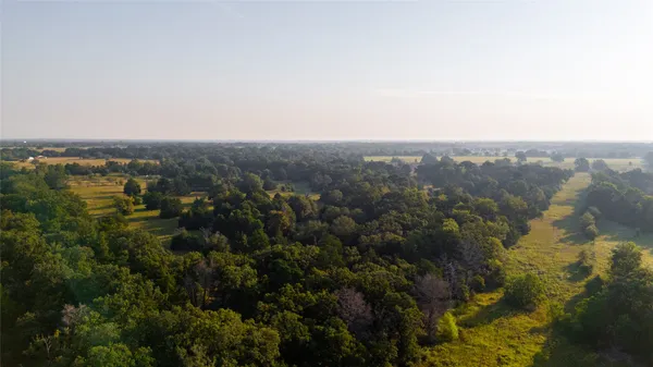 an aerial view of residential building and lake