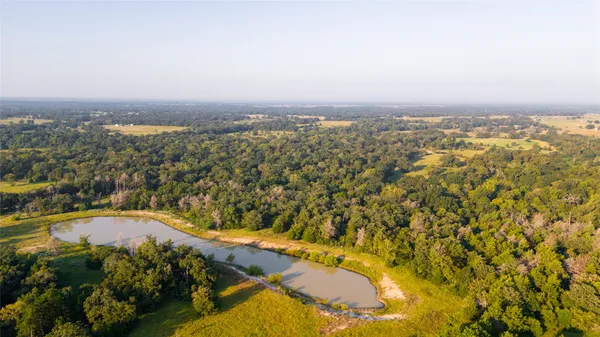 an aerial view of residential house and lake view