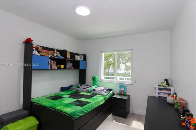 a room with window and wall paintings