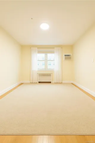 a view of a room with wooden floor and stairs