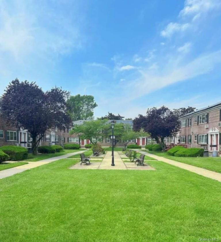 152-44 Jewel Avenue, Unit 102A Queens, NY 11367 - Photo 10 of 12 a view of outdoor space yard and mountain view in back