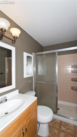 4027 Maxwell Road Colorado Springs, CO 80909 - Photo 27 of 35 Master bathroom- adjoins to master bedroom on upper level.
