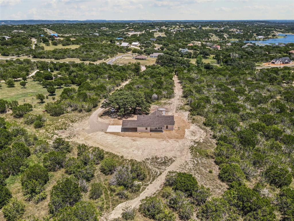 5470 Compass Way Bluff Dale, TX 76433 - Photo 25 of 26 an aerial view of residential houses with outdoor space