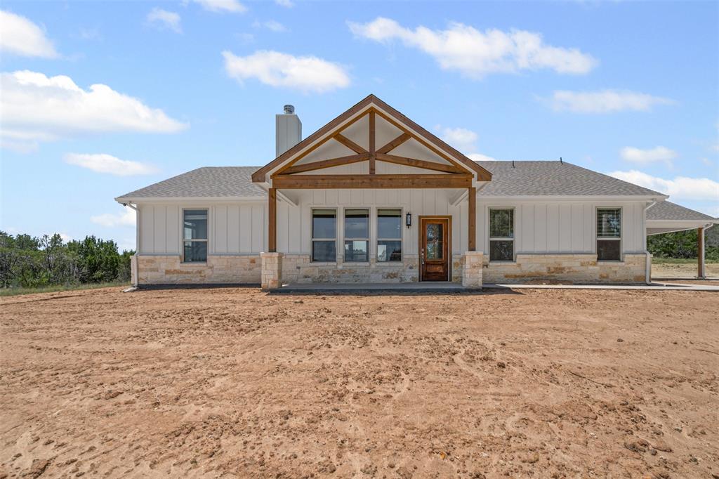 5470 Compass Way Bluff Dale, TX 76433 - Photo 4 of 26 a front view of a house with yard