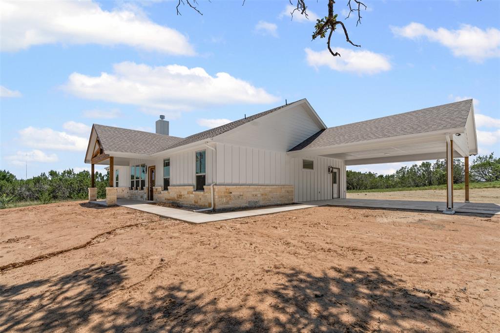 5470 Compass Way Bluff Dale, TX 76433 - Photo 5 of 26 a big house with a big yard and large trees