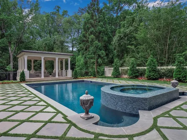 a view of a swimming pool with a patio