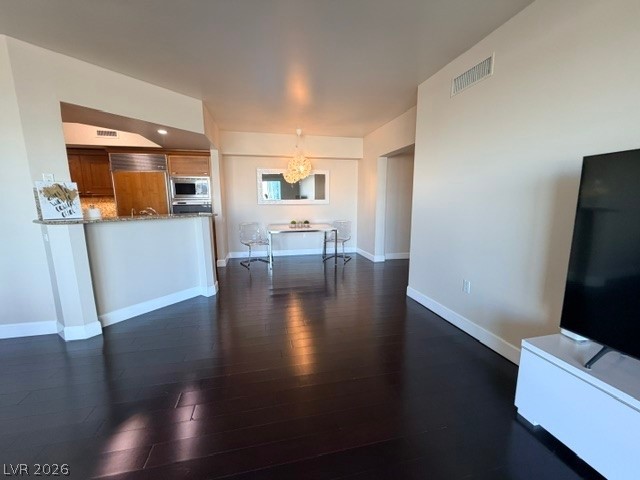 2777 Paradise Road, Unit 807 Las Vegas, NV 89109 - Photo 39 of 61 Rich hardwood flooring extends through this open-concept living area with a bright dining space.