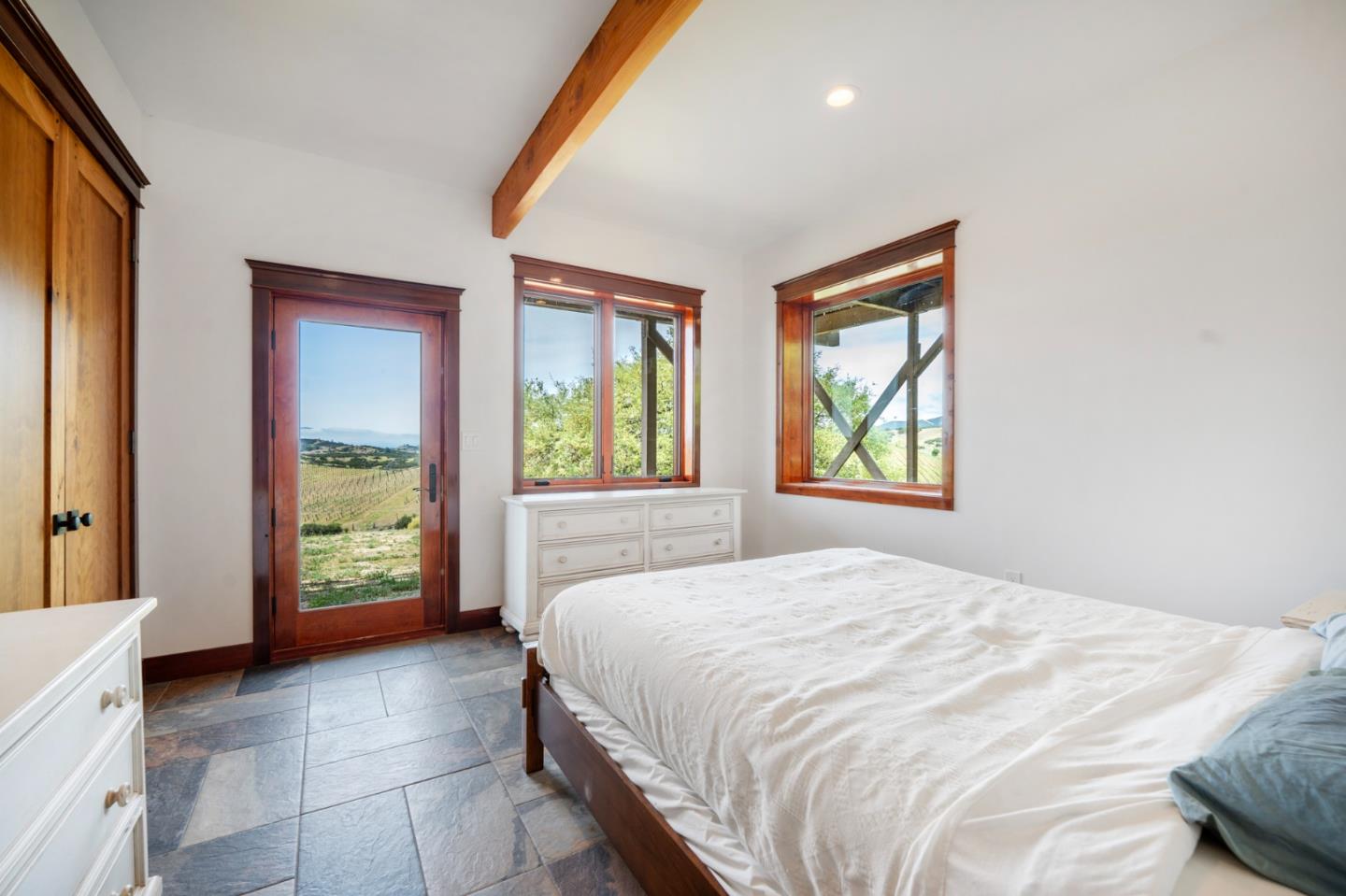 30625 Stonewall Canyon Road Soledad, CA 93960 - Photo 17 of 34 a bedroom with a bed and a large window