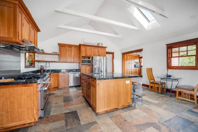 a kitchen with stainless steel appliances granite countertop lots of counter top space