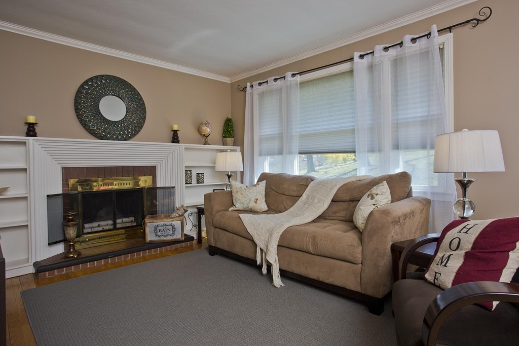168 West Allen Ridge Road Springfield, MA 01118 - Photo 10 of 24 a living room with furniture and a fireplace
