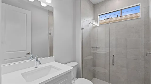 a bathroom with a sink a toilet and a bathtub