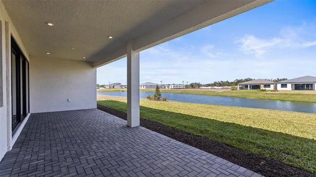 a front view of house with yard and garage