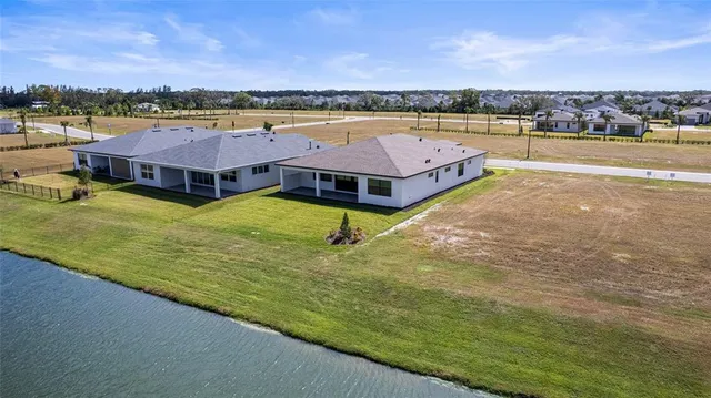an aerial view of a city with lawn chairs