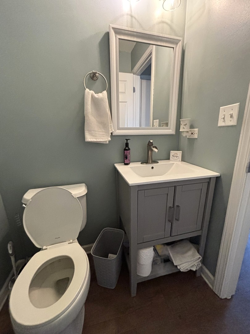 16047 Tiger Drive Lockport, IL 60441 - Photo 11 of 24 a bathroom with a toilet a sink and mirror