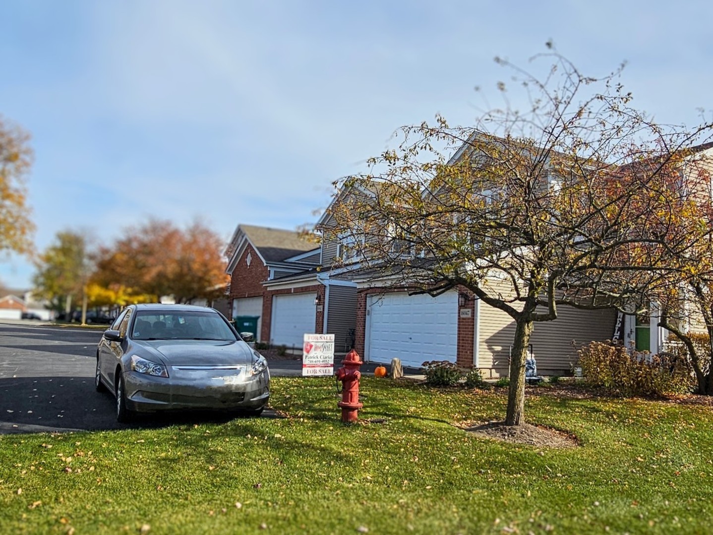 16047 Tiger Drive Lockport, IL 60441 - Photo 2 of 24 a front view of a house with a yard and garage