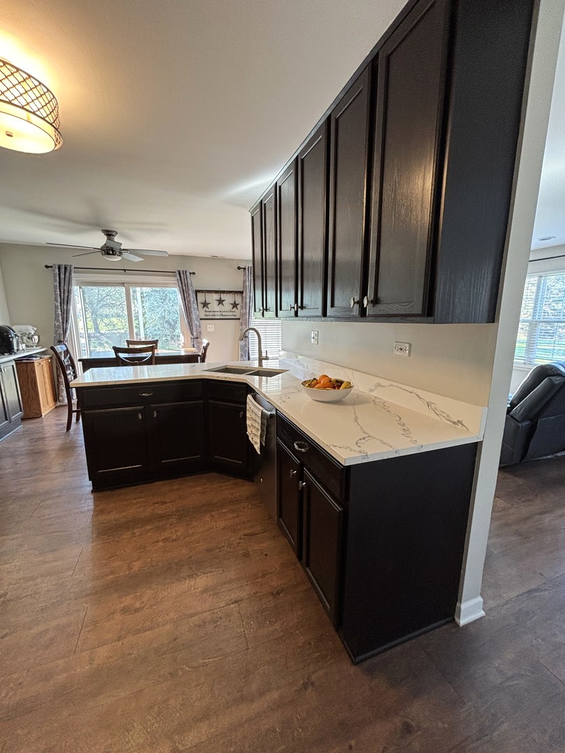 16047 Tiger Drive Lockport, IL 60441 - Photo 7 of 24 a kitchen with a stove and a refrigerator