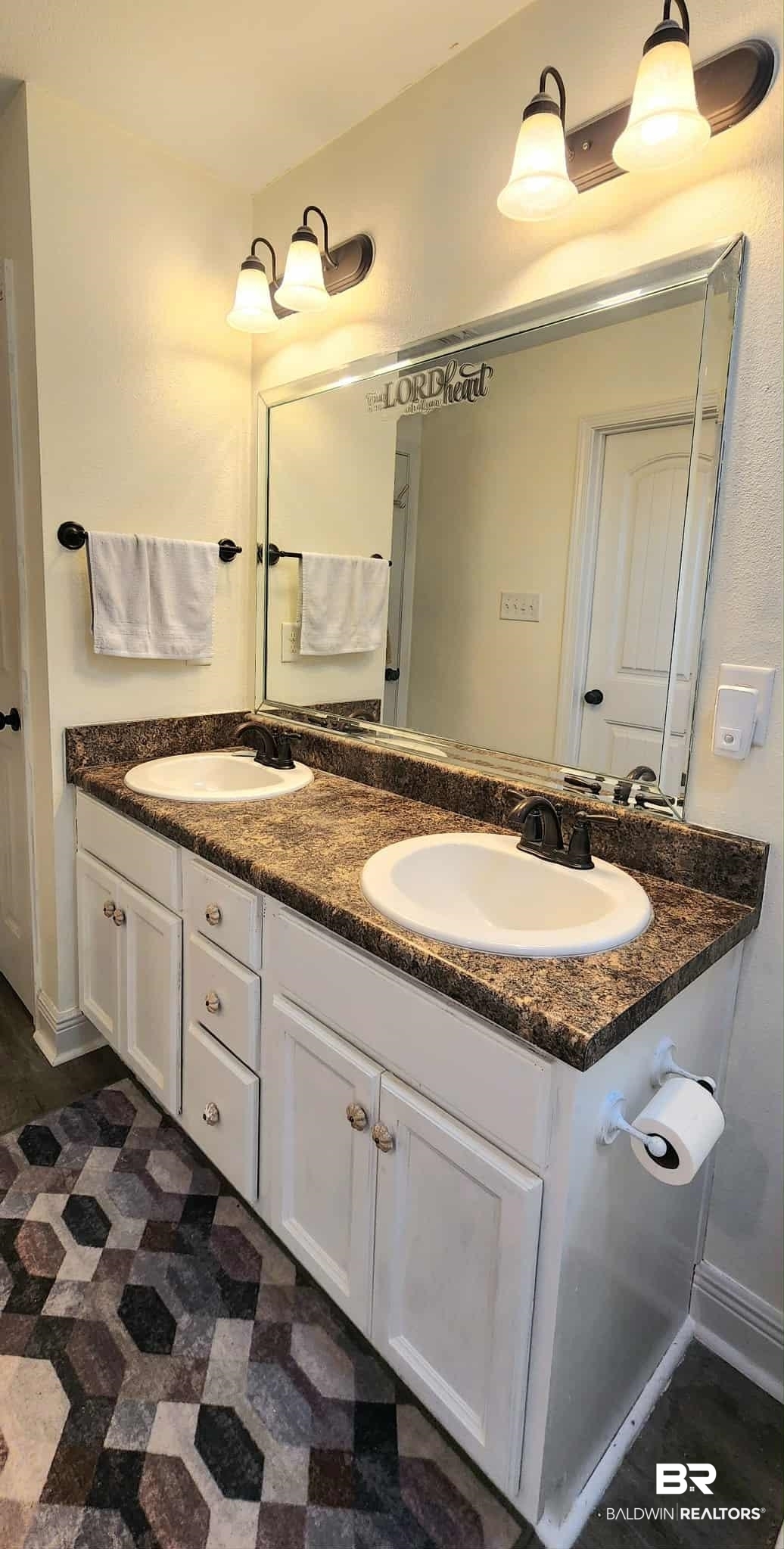 15623 Medway Court Foley, AL 36535 - Photo 20 of 29 Bathroom with double vanity and baseboards