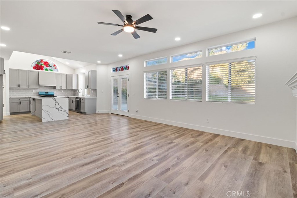 14439 Grandifloras Road Canyon Country, CA 91387 - Photo 11 of 45 a view of an empty room with a window and wooden floor