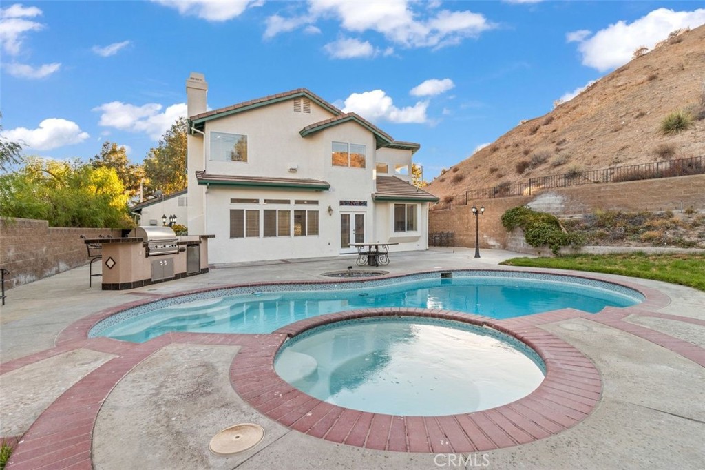14439 Grandifloras Road Canyon Country, CA 91387 - Photo 2 of 45 a view of a house with swimming pool