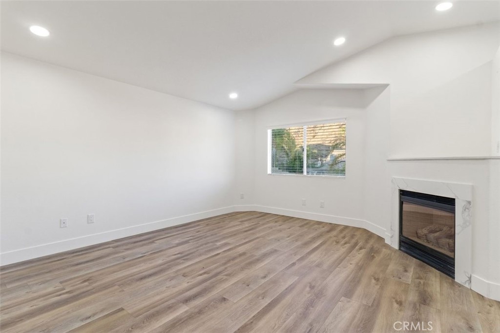 14439 Grandifloras Road Canyon Country, CA 91387 - Photo 22 of 45 an empty room with windows and fireplace