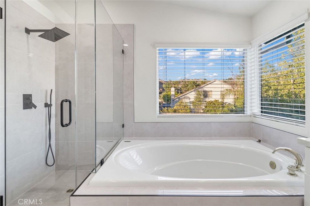 14439 Grandifloras Road Canyon Country, CA 91387 - Photo 23 of 45 a white bath tub sitting next to a shower