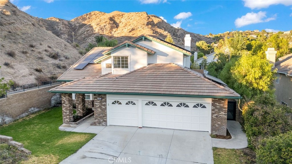 14439 Grandifloras Road Canyon Country, CA 91387 - Photo 35 of 45 a front view of a house with garden