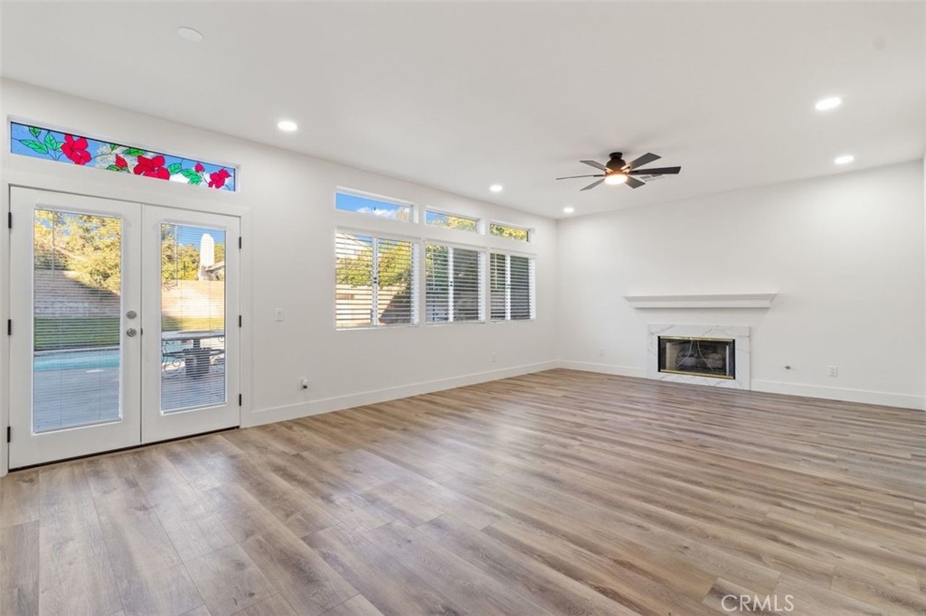 14439 Grandifloras Road Canyon Country, CA 91387 - Photo 9 of 45 a view of an empty room with a window and fireplace