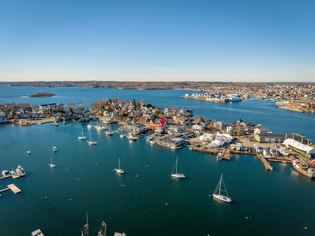 73 Rocky Neck Avenue, Unit 2 Gloucester, MA 01930 - Photo 20 of 22 an aerial view of ocean and residential houses with outdoor space