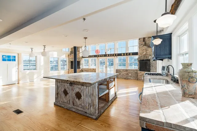 a kitchen with stainless steel appliances granite countertop a stove and a sink