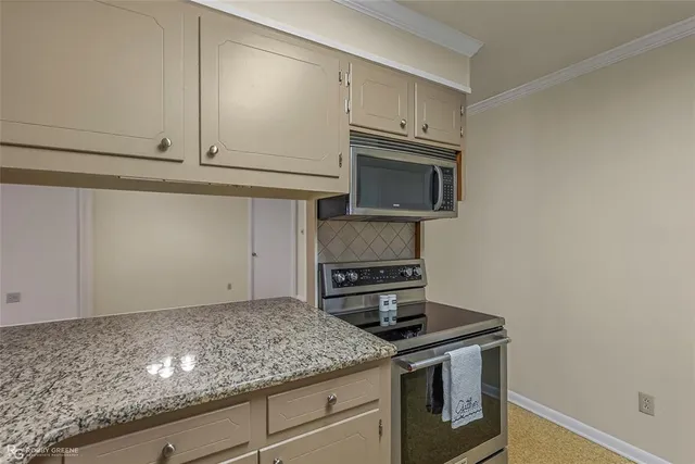 a view of an empty room with a ceiling fan