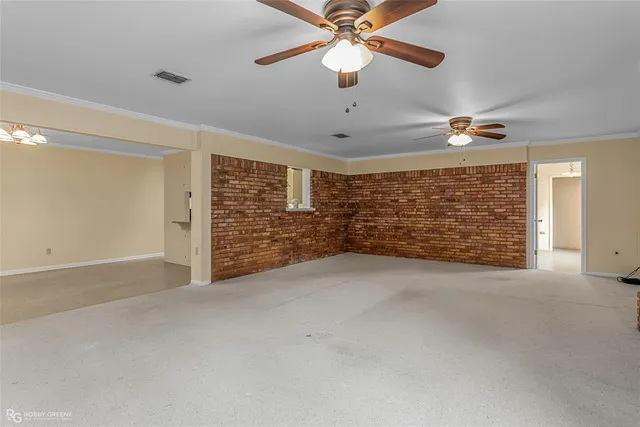 a view of empty room with windows