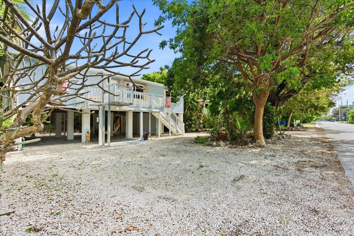 22 Stirrup Key Road Marathon, FL 33050 - Photo 44 of 48 a big house with large trees and large tree