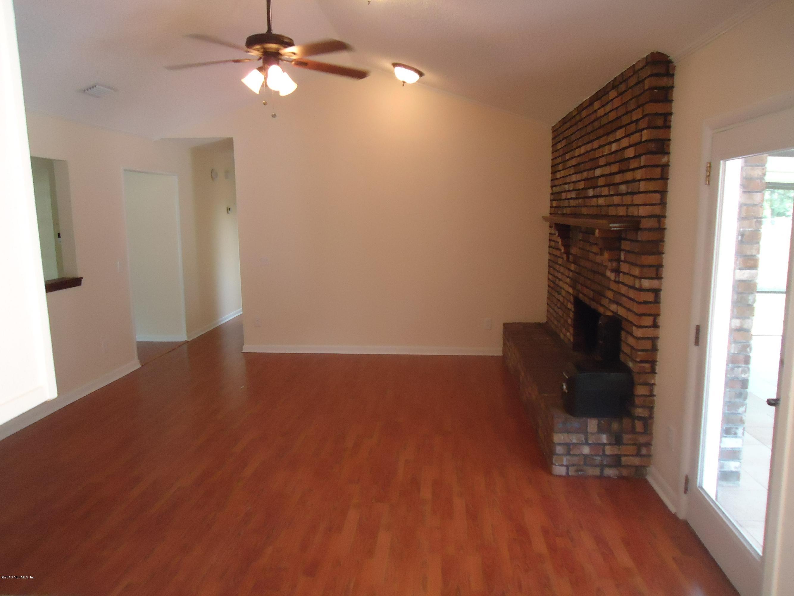 408 Raggedy Point Court Fleming Island, FL 32003 - Photo 5 of 14 Brick Fireplace with Mantle