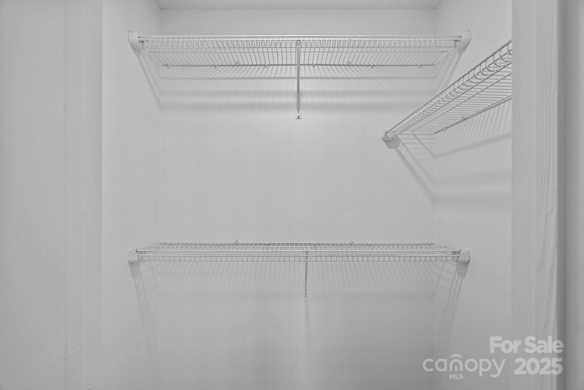 7100 Windsong Way Wingate, NC 28174 - Photo 19 of 26 a view of a room with racks on the wall